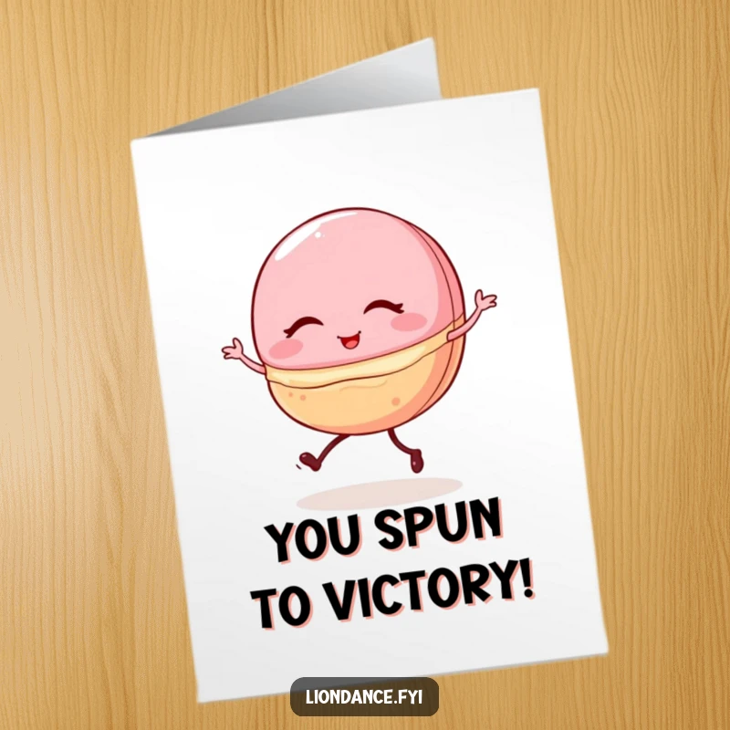 Funny Free Printable Congrats Card: A winking macaron character with tiny legs performing a wobbly but enthusiastic ballet pirouette.
